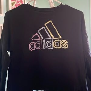 Black long sleeve adidas shirt.